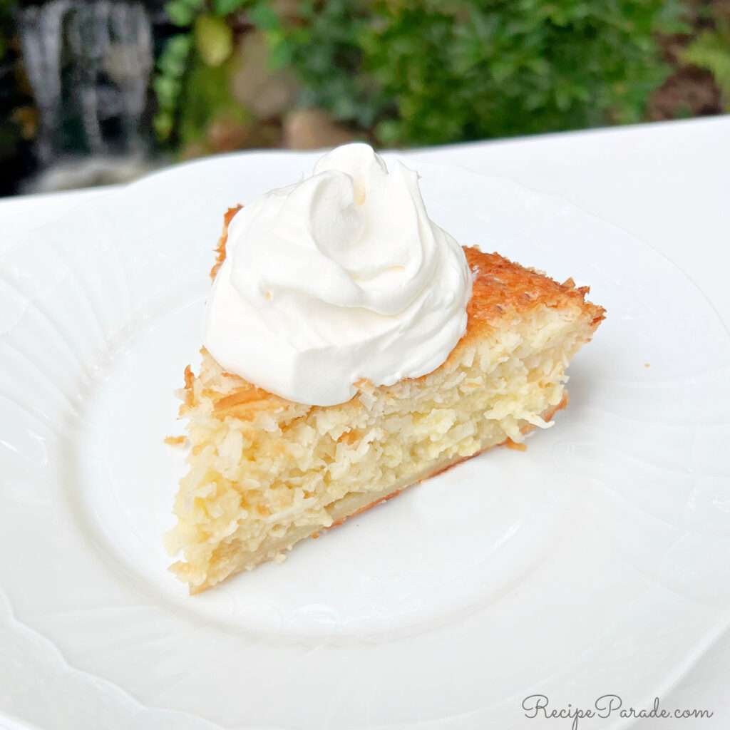 Slice of Impossible Coconut Pie on a plate.