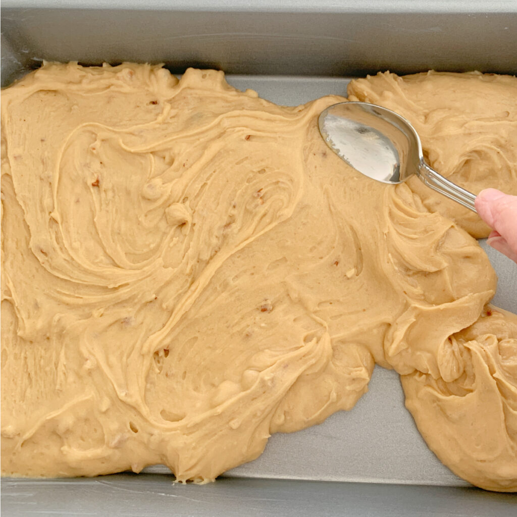 Spreading the batter for butterscotch squares.