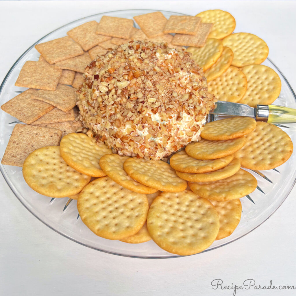 Pineapple Cream Cheese Ball on a platter with crackers.