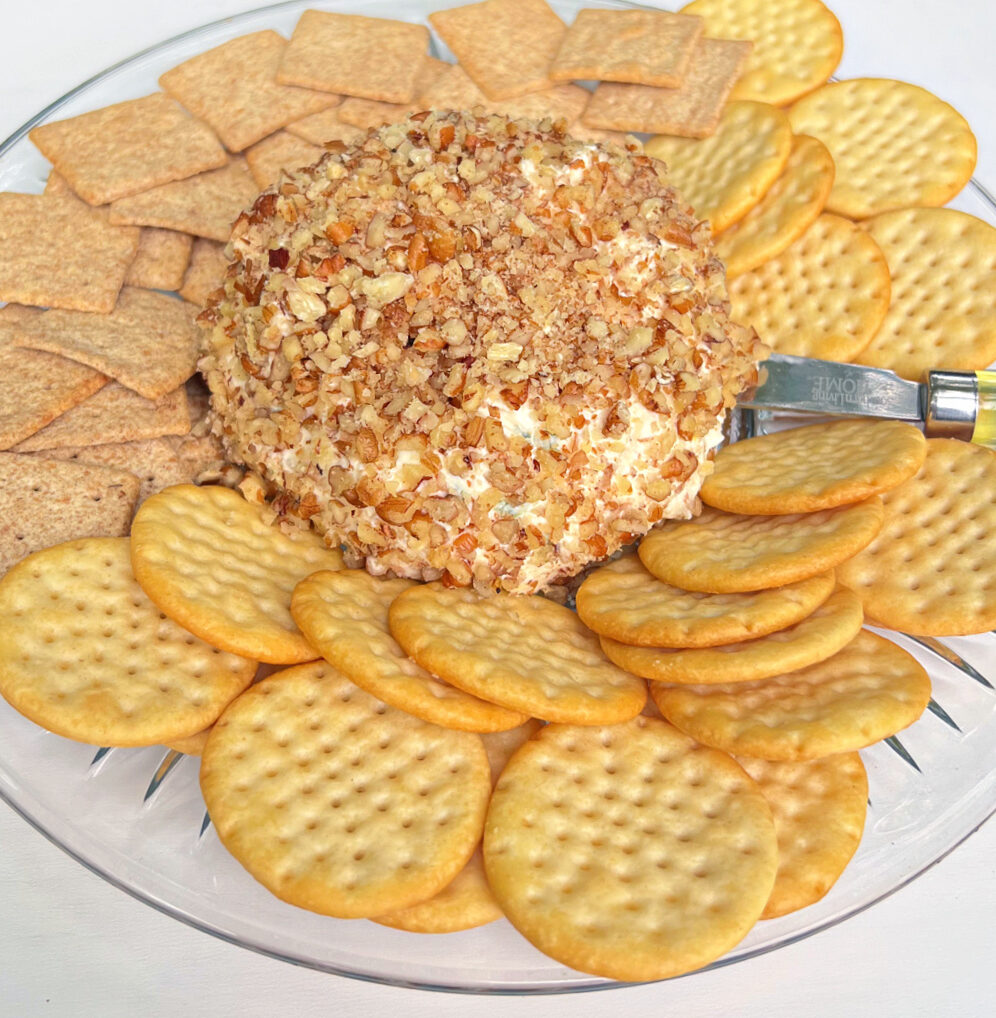 Pineapple Cream Cheese Ball on a platter with crackers.