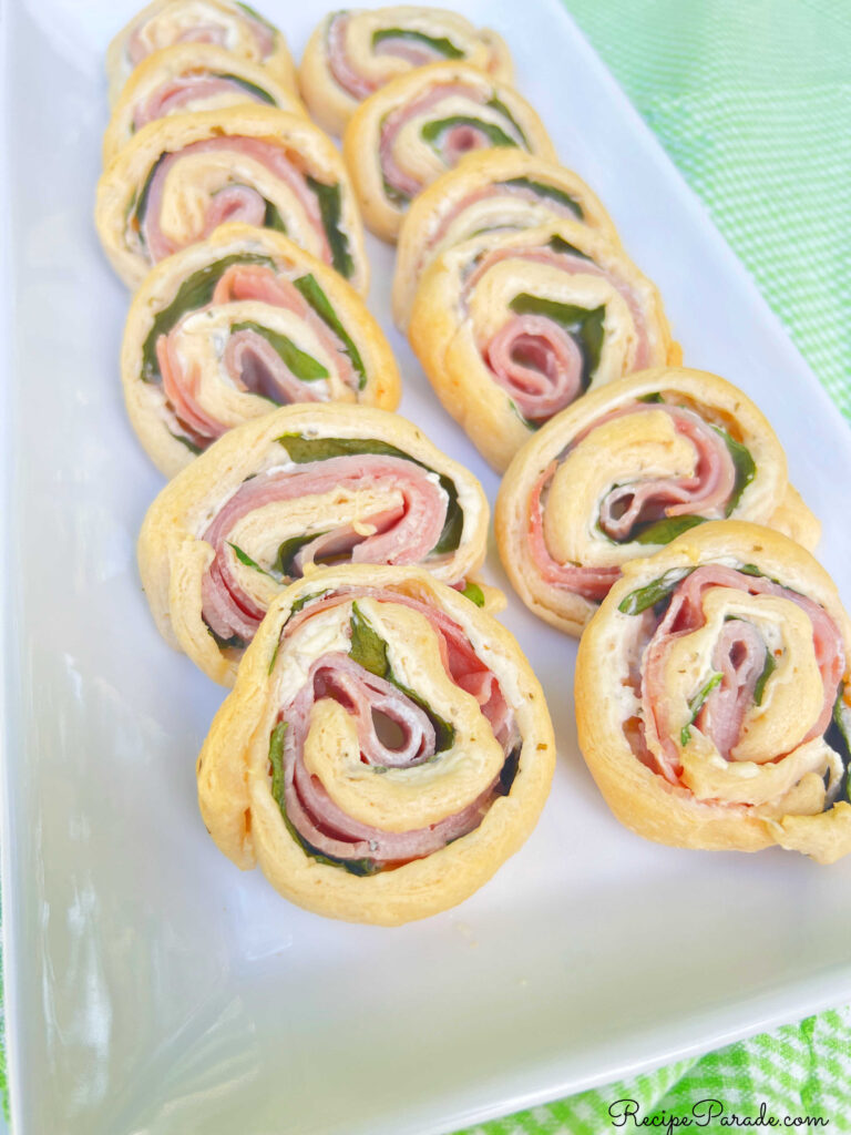Ham and cheese pinwheels on a platter.