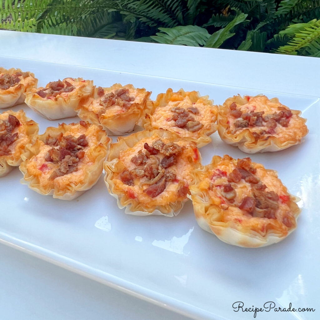 Pimento Cheese Bites lined up on a platter.
