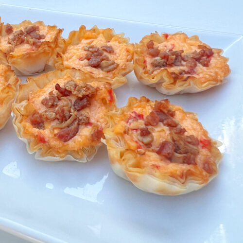Pimento Cheese Bites lined up on a platter.