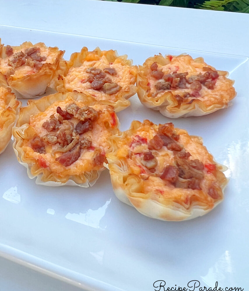 Pimento Cheese Bites lined up on a platter.