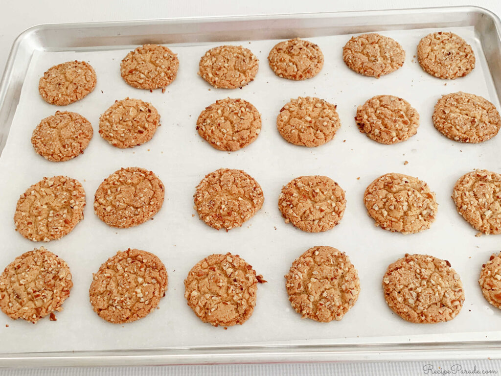 Butter Pecan Cookies, freshly baked on a cookie sheet.