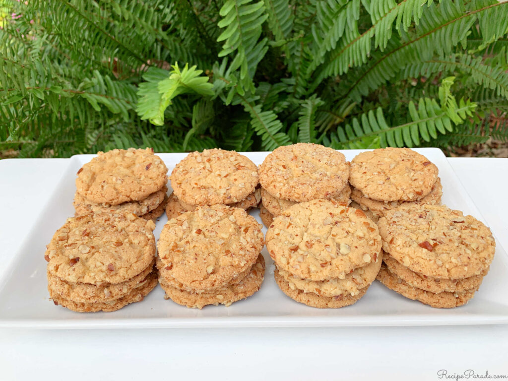 Butter pecan cookies, stacked on a platter.