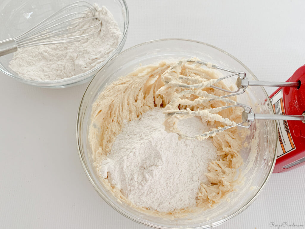 Mixing in the flour into the butter pecan cookie batter.