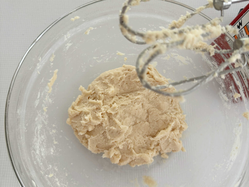 Dough in a bowl for crust of pecan tarts.