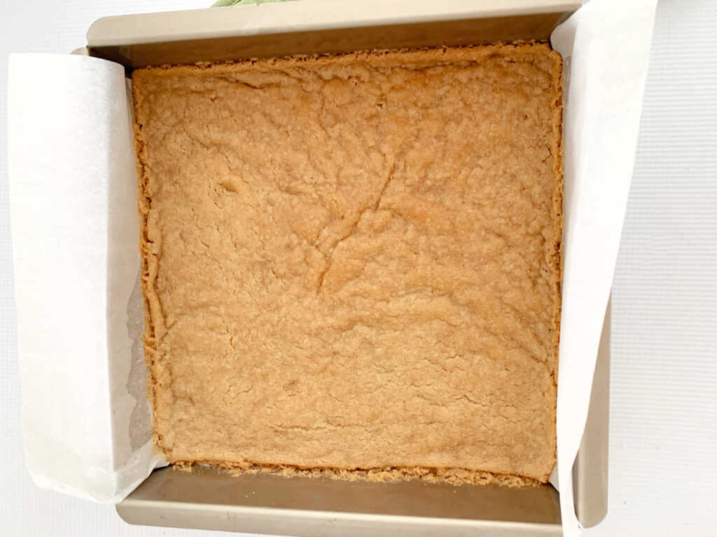 Freshly baked shortbread crust for dream bars.