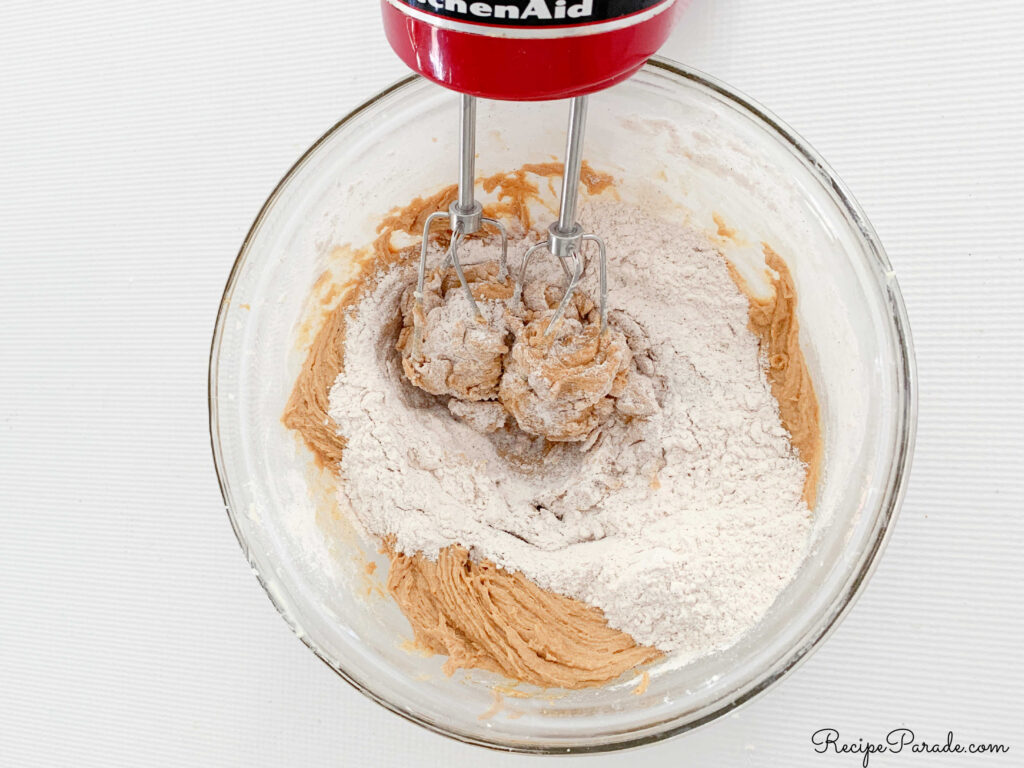 GInger snaps batter in a bowl.