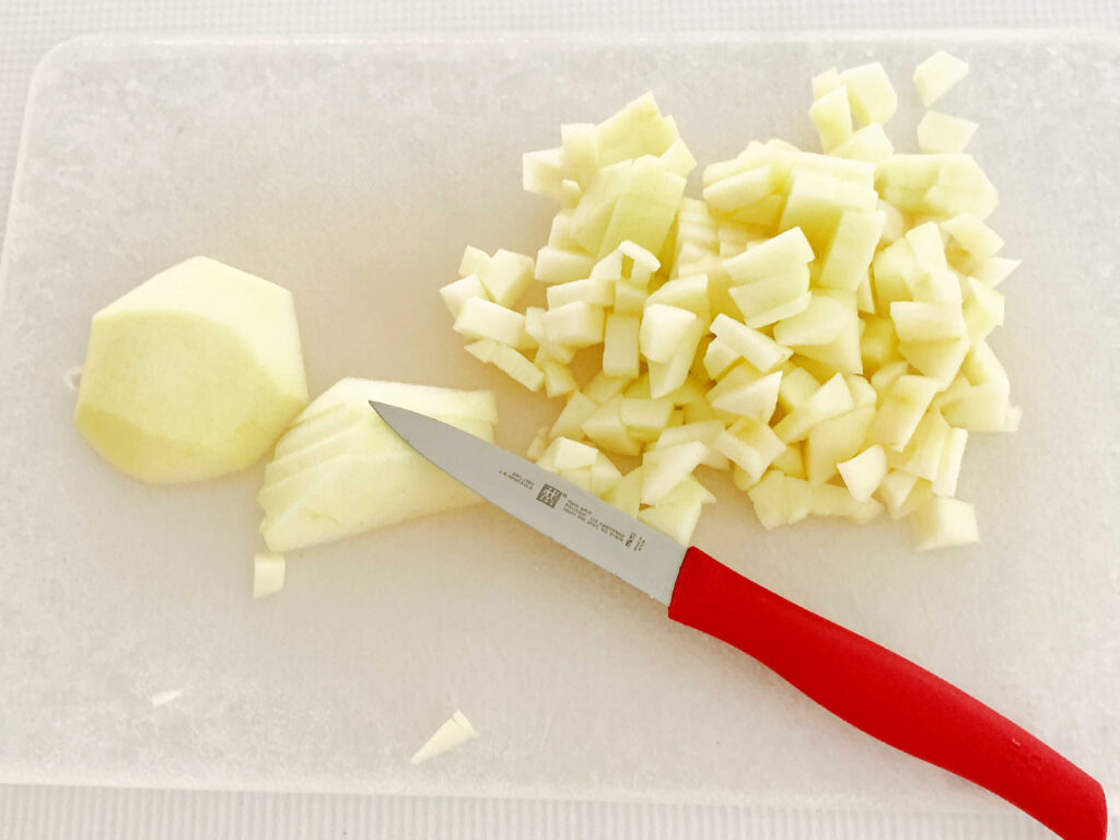 Sliced apples on a cutting board.