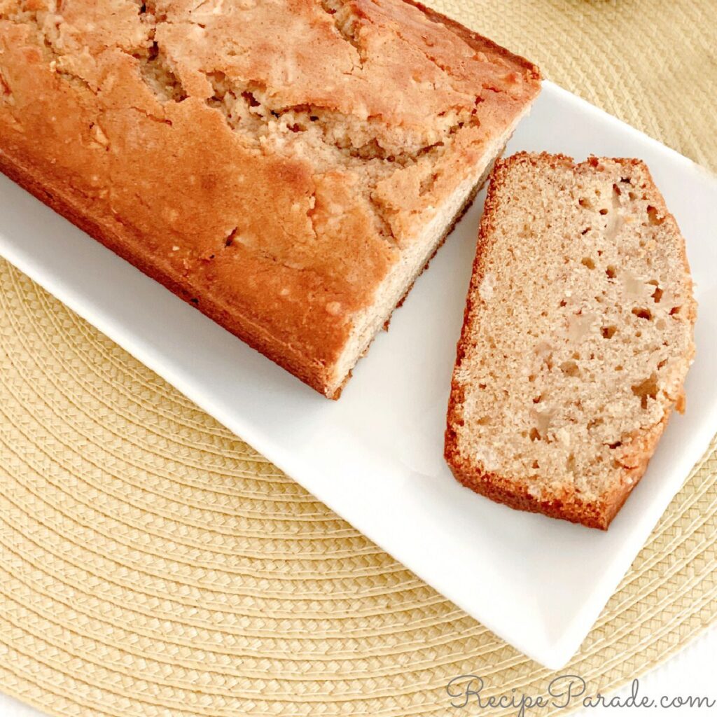 Apple bread, sliced, on a cake plate.