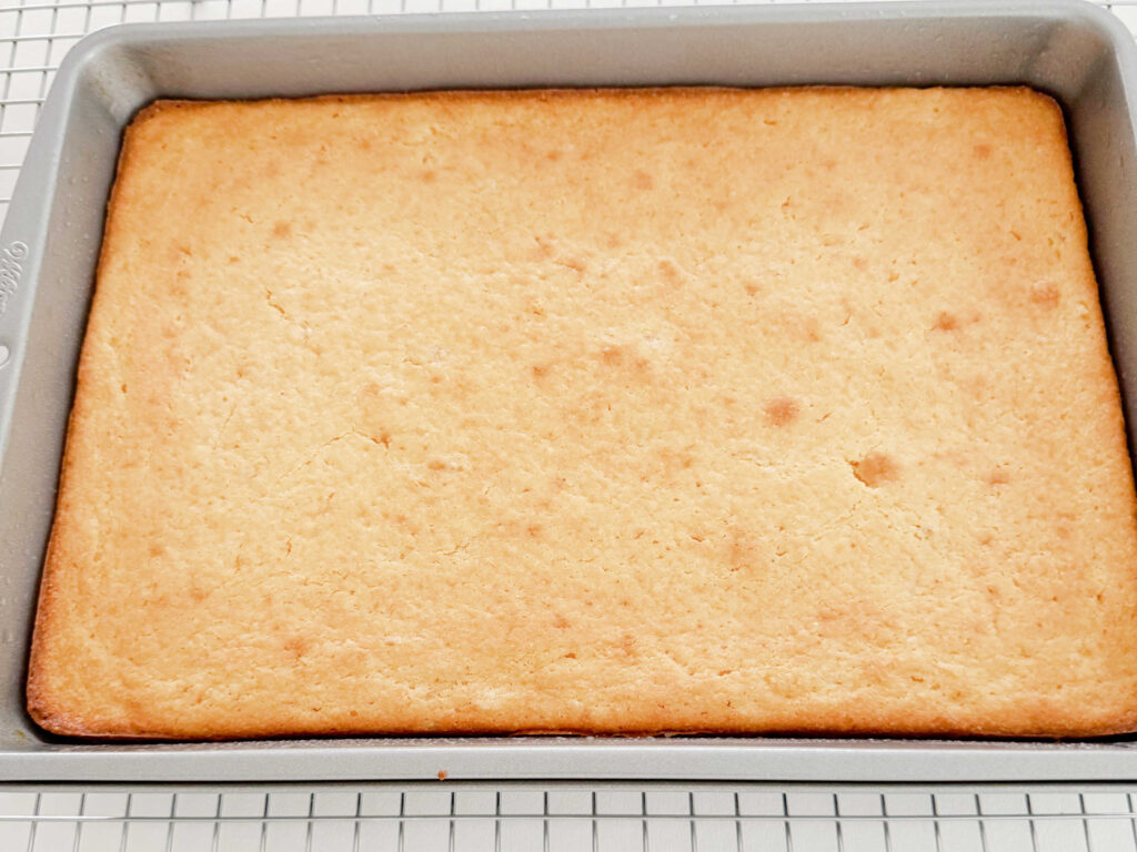Pan of freshly baked cornbread on a cooling rack.
