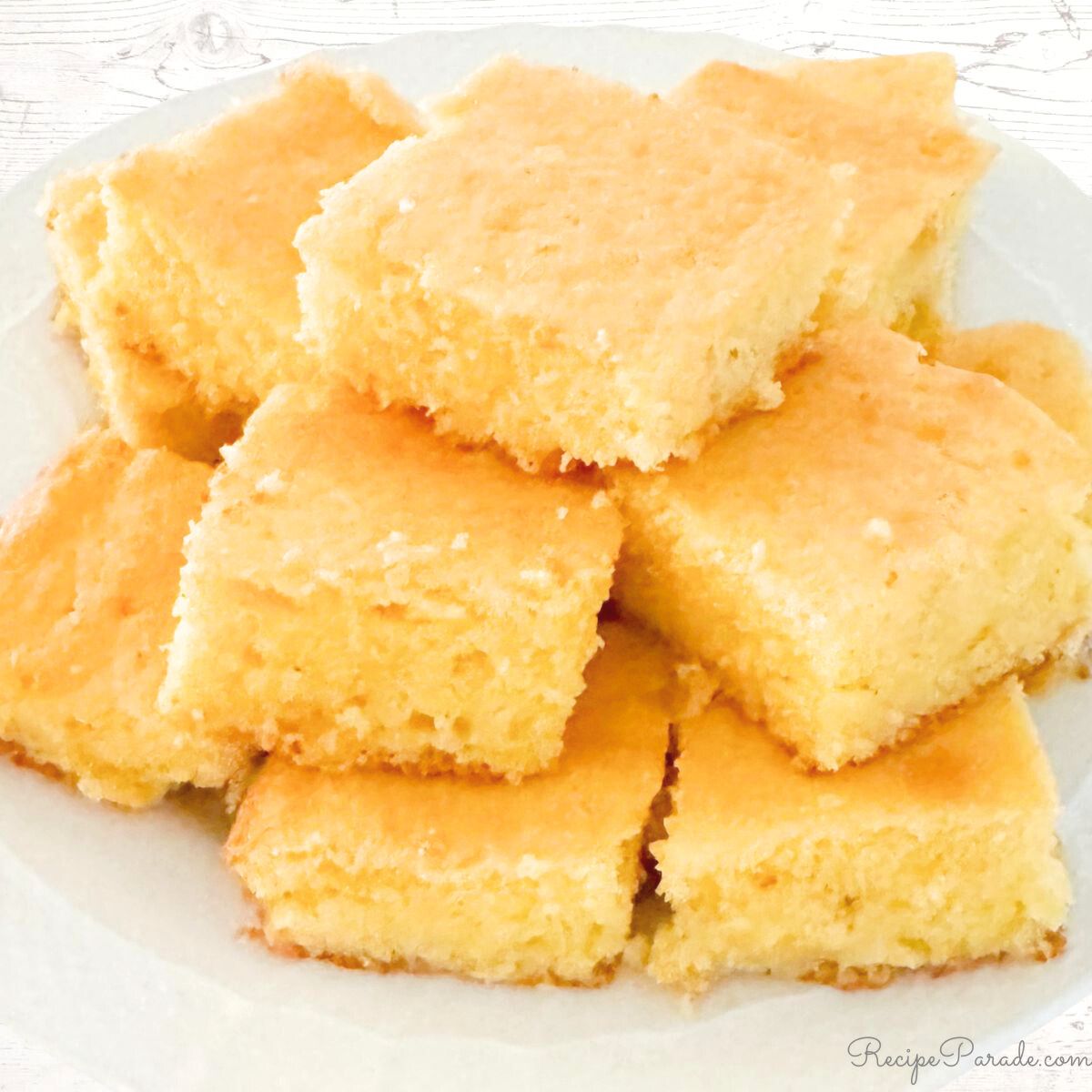 Cornbread stacked on a plate.