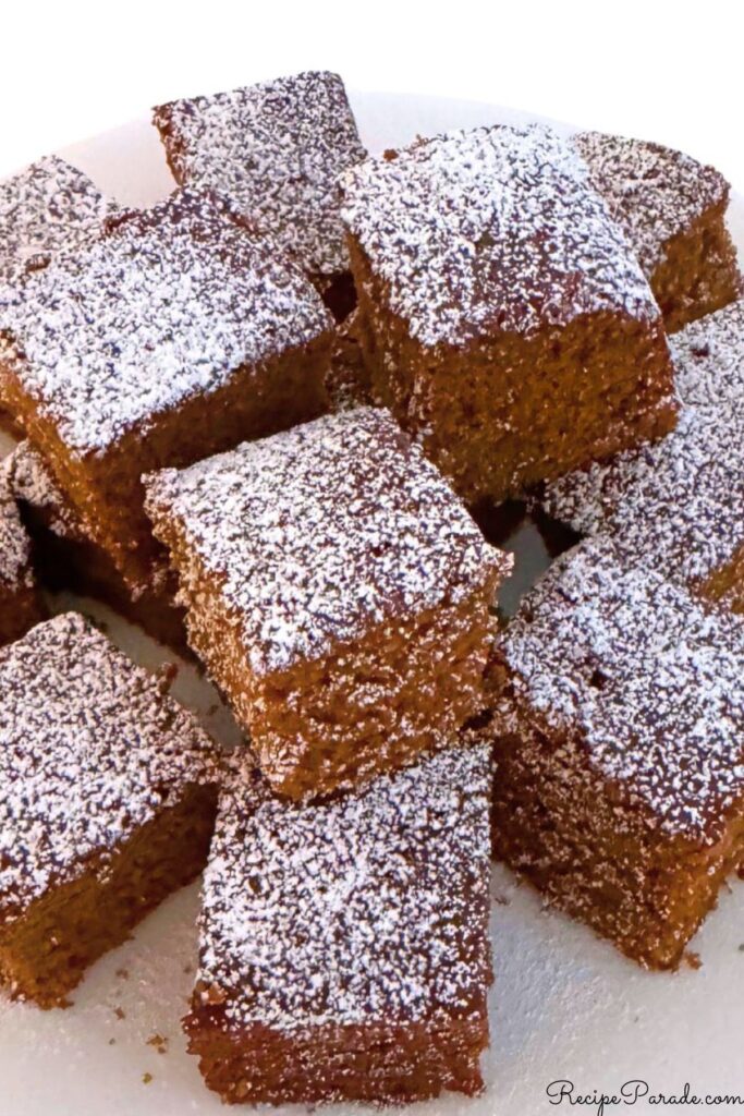 Gingerbread, stacked on a plate.