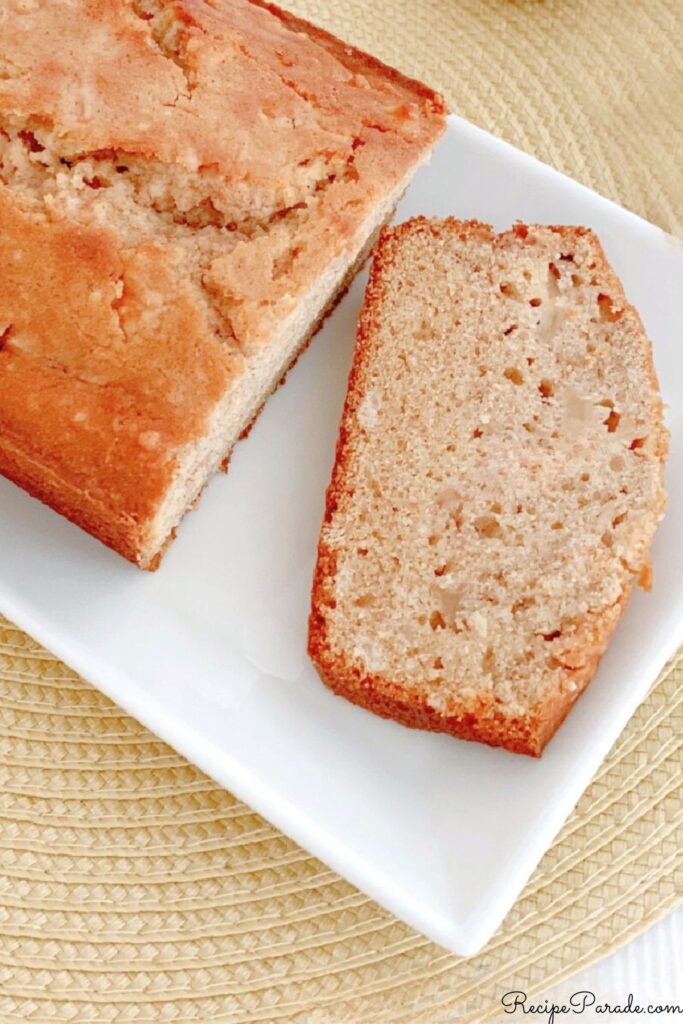Homemade Apple Bread, sliced, on a plate.