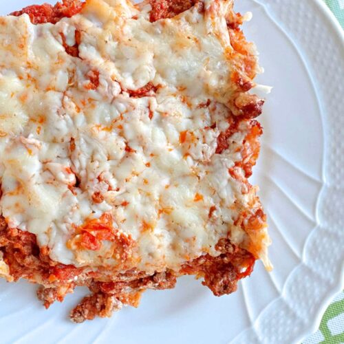 Slice of Cheesy Pasta Bake on a plate.