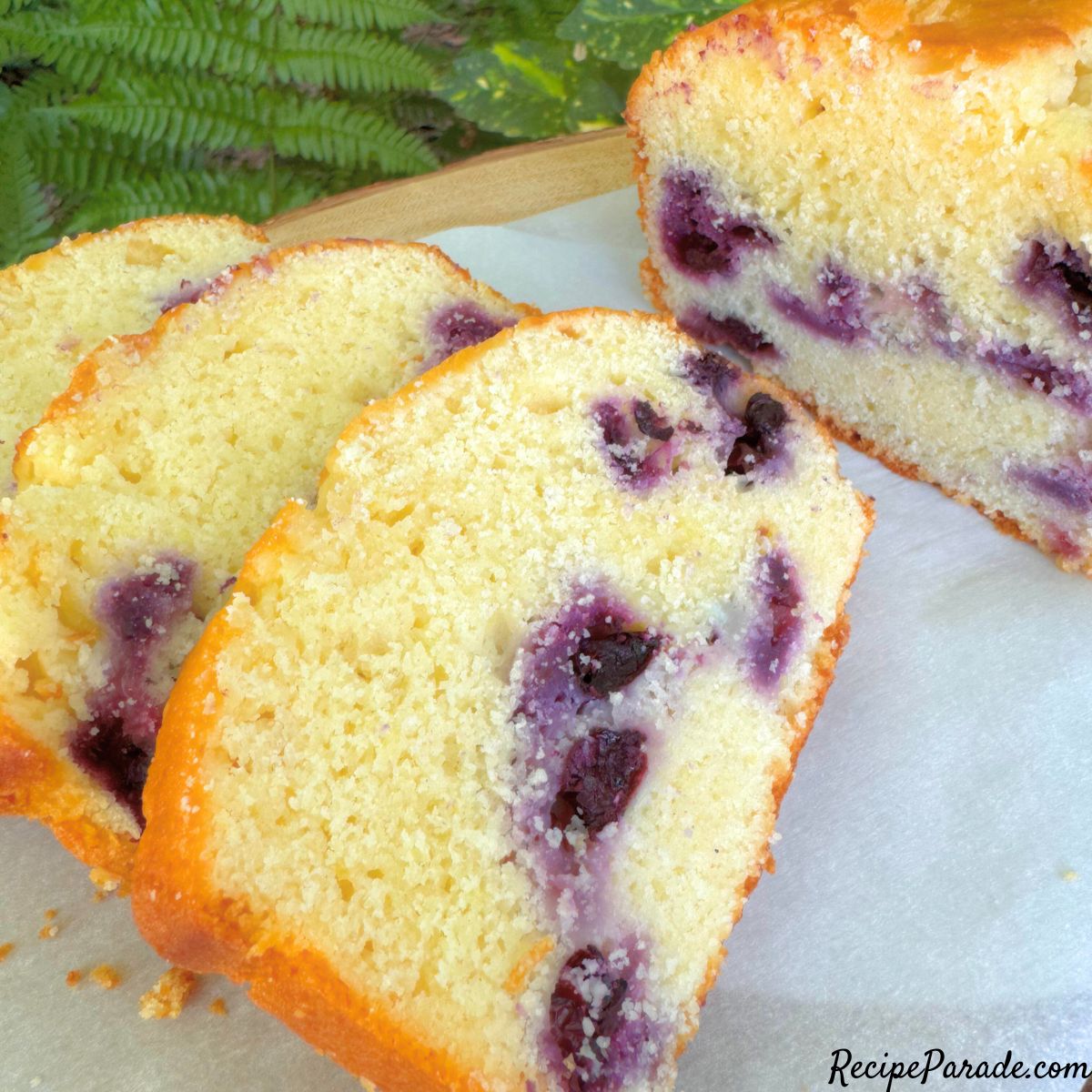 Sliced Lemon Blueberry Bread on platter.