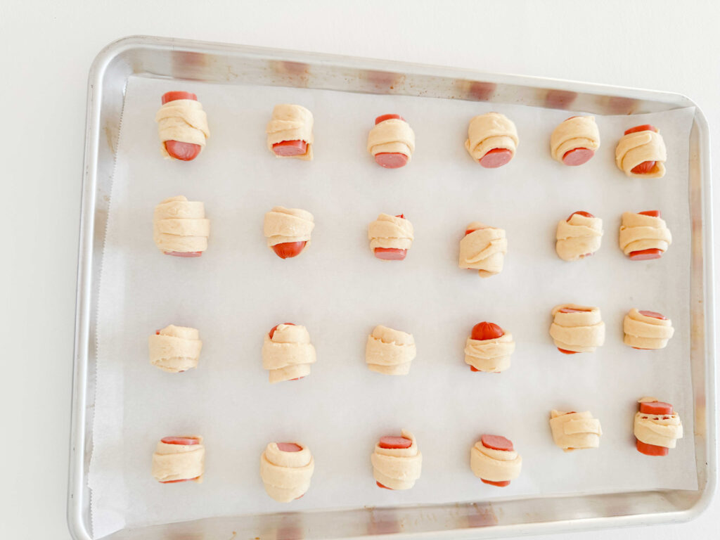 Pigs in a Blanket on a Baking Sheet, before baking.