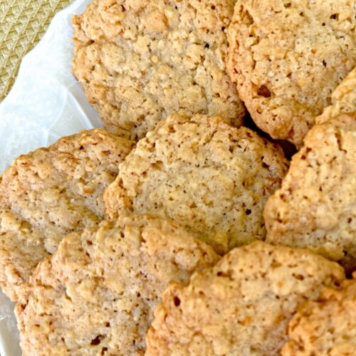 Crisp oatmeal cookies on a plate.