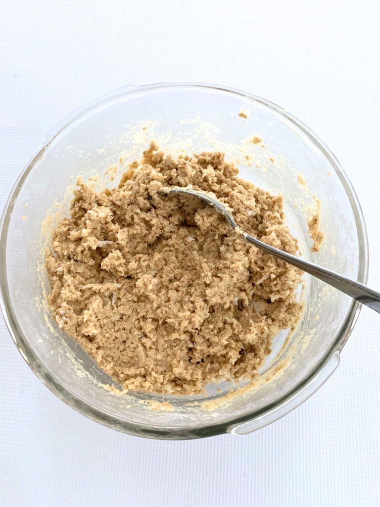 Bowl of batter for oatmeal coconut cookies.