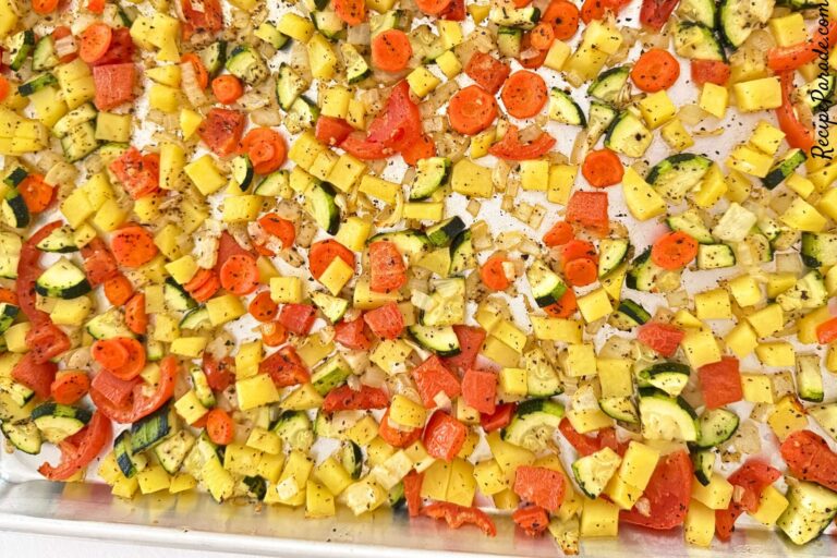 Roasted vegetables on a baking sheet.