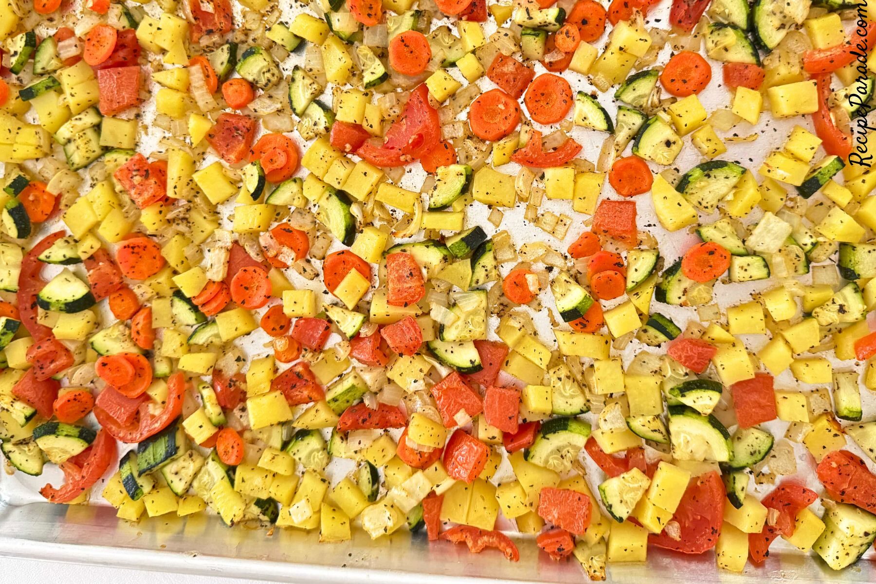 Roasted vegetables on a baking sheet.