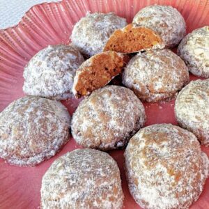 Chocolate Mexican Wedding Cookies on a plate.