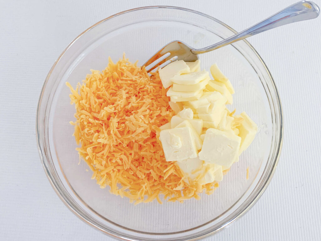 Butter and grated cheddar.