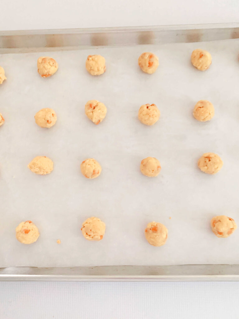 Butterscotch Cookie Dough Balls on cookie sheet.