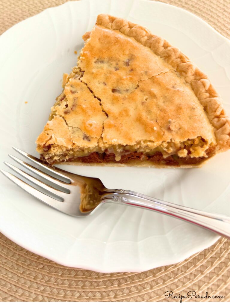 Slice of Chocolate Chip Pie on a plate.